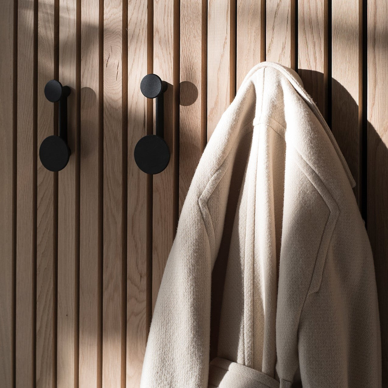 Coat rack, Small, in black-brass designed by Afteroom Studio
